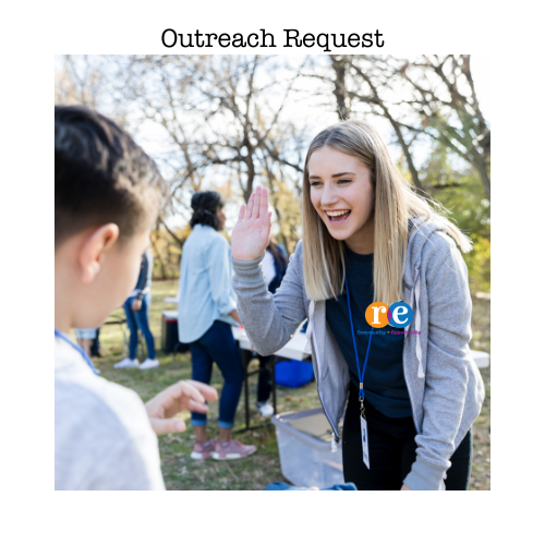 Woman with RE on shirt, speaking to young boy at an Outreach event
