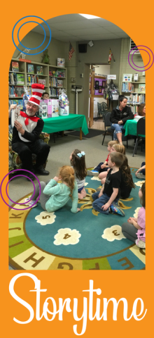 Man dressed as Cat in the Hat reading to children seated on floor